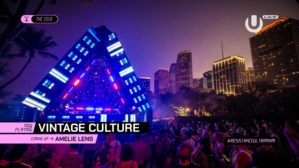Live broadcast lower-third graphic for Ultra Music Festival's The Cove stage, showing Vintage Culture now playing and Amelie Lens coming up next